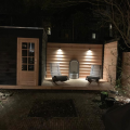 tuin complete metamorfose met tuinhuis en schuttingen en zitje  werk Amsterdam
